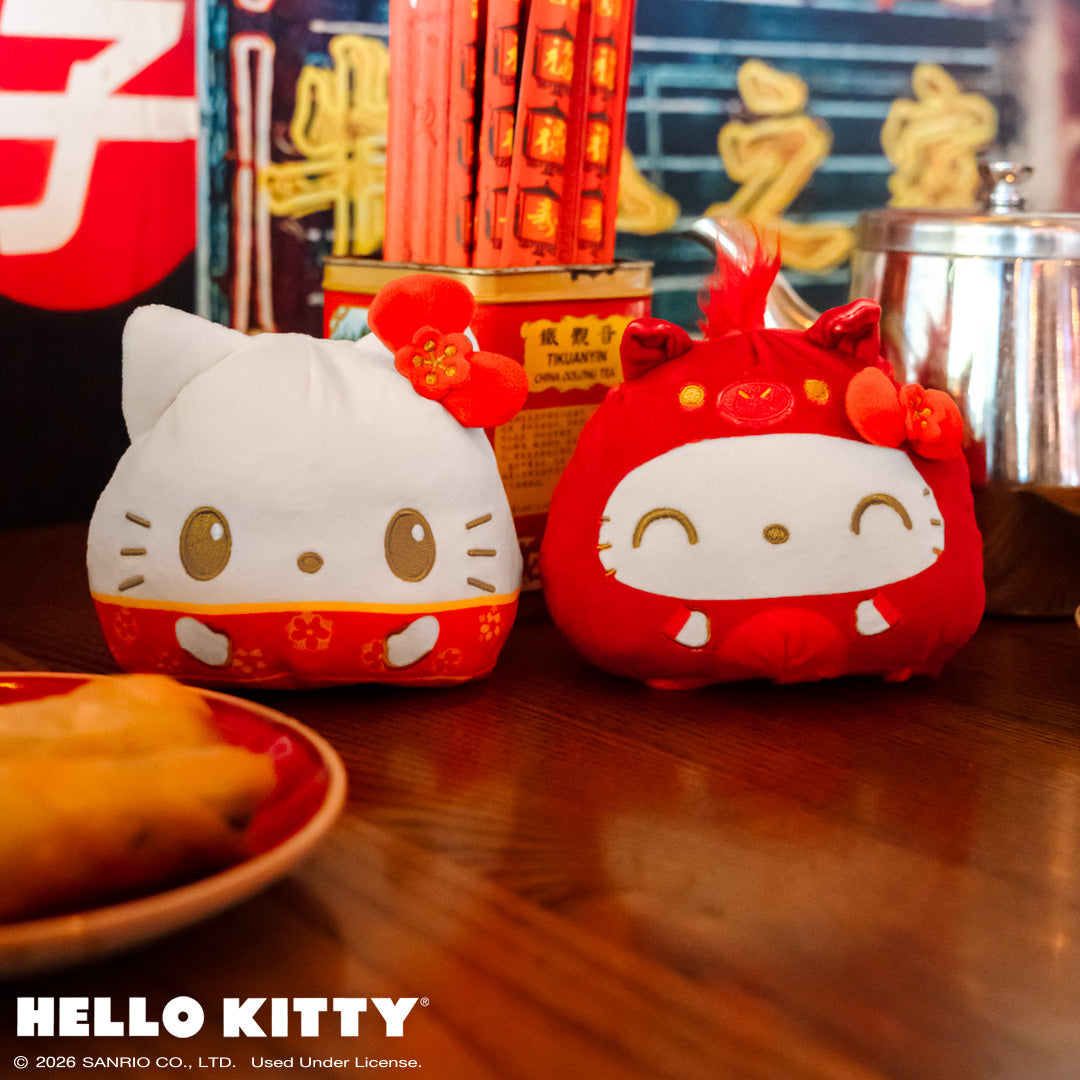 Lunar New Year Horse Hello Kitty 4" Reversible showing both sides sitting on a table with Lunar New Year food, and sparklers