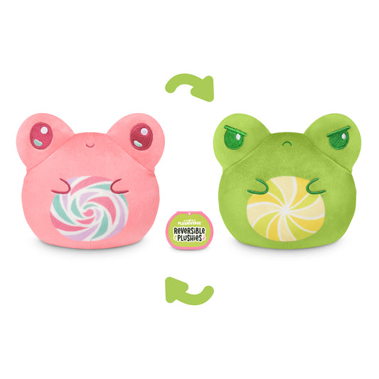 A TeeTurtle Plushiverse Lollihop Frog 4” Reversible Plushie toy with green and pink colors, showcasing its emotions with an arrow pointing to it.