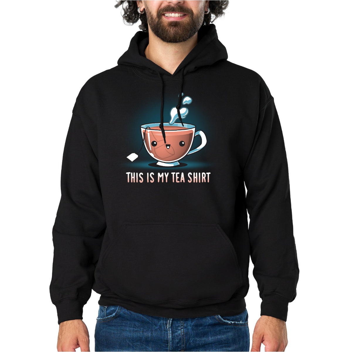 Pullover Hoodie_TeeTurtle black My Tea Shirt featuring a smiling teacup with a tea bag inside. Text below reads, "This is My Tea Shirt."