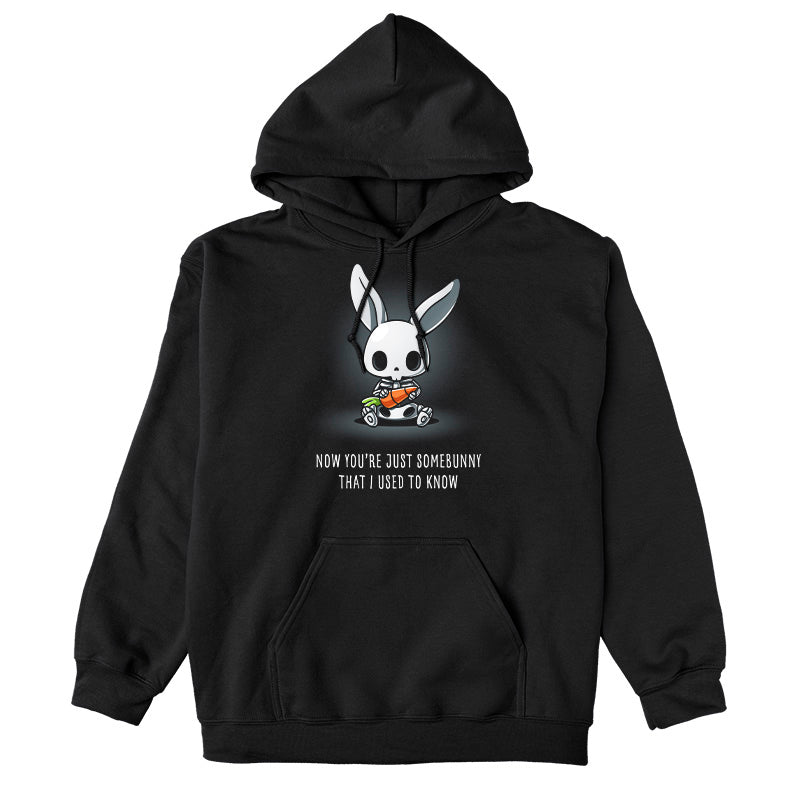 Pullover Hoodie_TeeTurtle black Somebunny That I Used to Know apparel featuring a bunny skeleton sitting down holding a giant carrot with the caption, “Now You’re Just Somebunny That I Used to Know“.