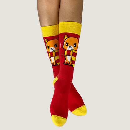 A pair of Brave Kitty Socks with a cat on them by TeeTurtle.