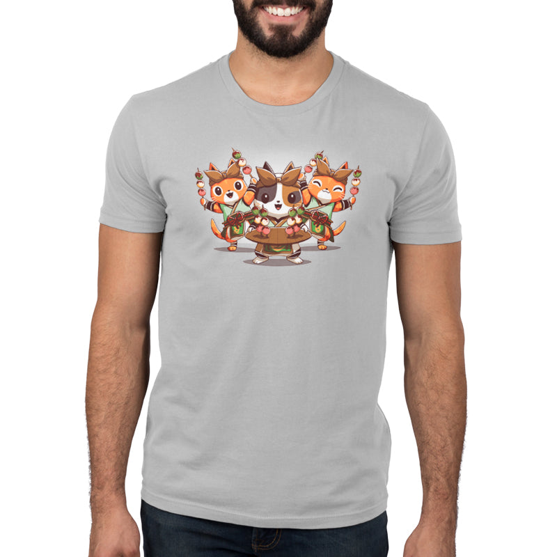 A Monster Hunter fan proudly shows off his Village Chef Felynes t-shirt adorned with two foxes, representing his love for the game.