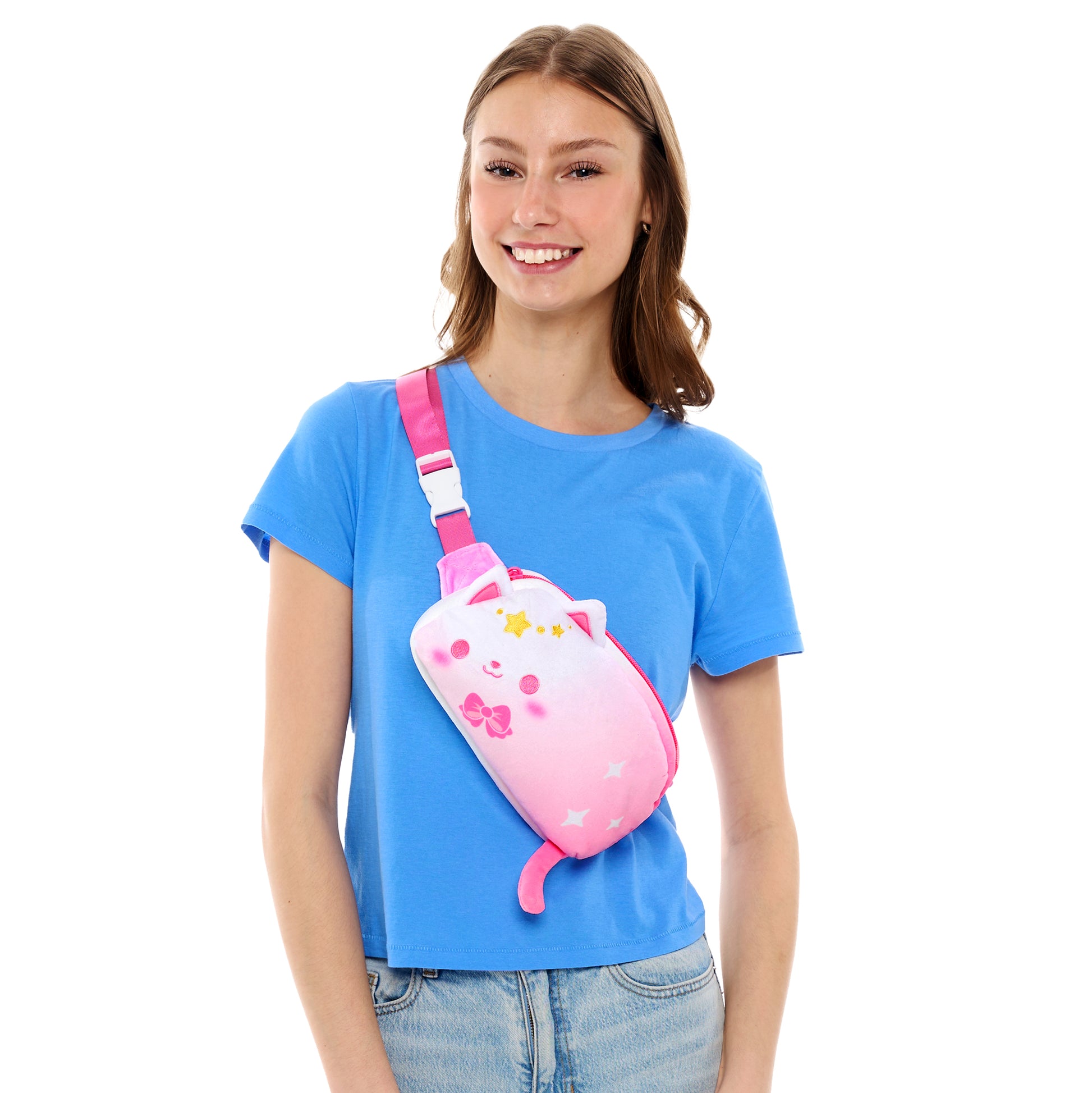 Young woman in a blue t-shirt smiling with a Plushiverse Just Like Meowgic Plushie Fanny Pack from the TeeTurtle Kawaii Cuties collection.