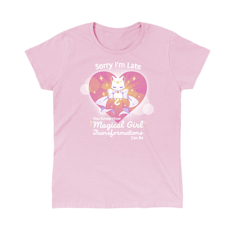 Classic Cotton T-shirt_TeeTurtle light pink Magical Girl Transformations apparel featuring a cat floating in a heart with a large bow and sparkles like classic anime girl. Captions says, "Sorry I'm late, you know how magical girl transformations can be".