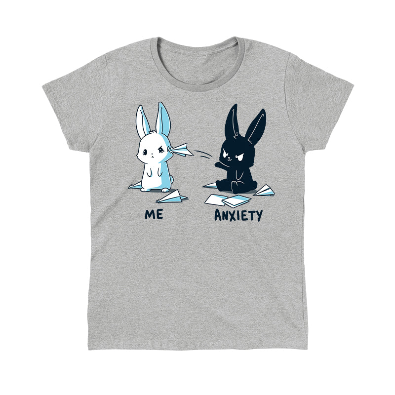 Classic Cotton T-shirt_TeeTurtle Me vs Anxiety heather gray t-shirt featuring an illustration of two cartoon bunnies. A white bunny is labeled "Me," and is looking annoyed while a paper airplane crashes into its face, while a black bunny labeled "Anxiety" aggressively throws paper planes at the other bunny. Paper planes are scattered on the ground around anxiety.