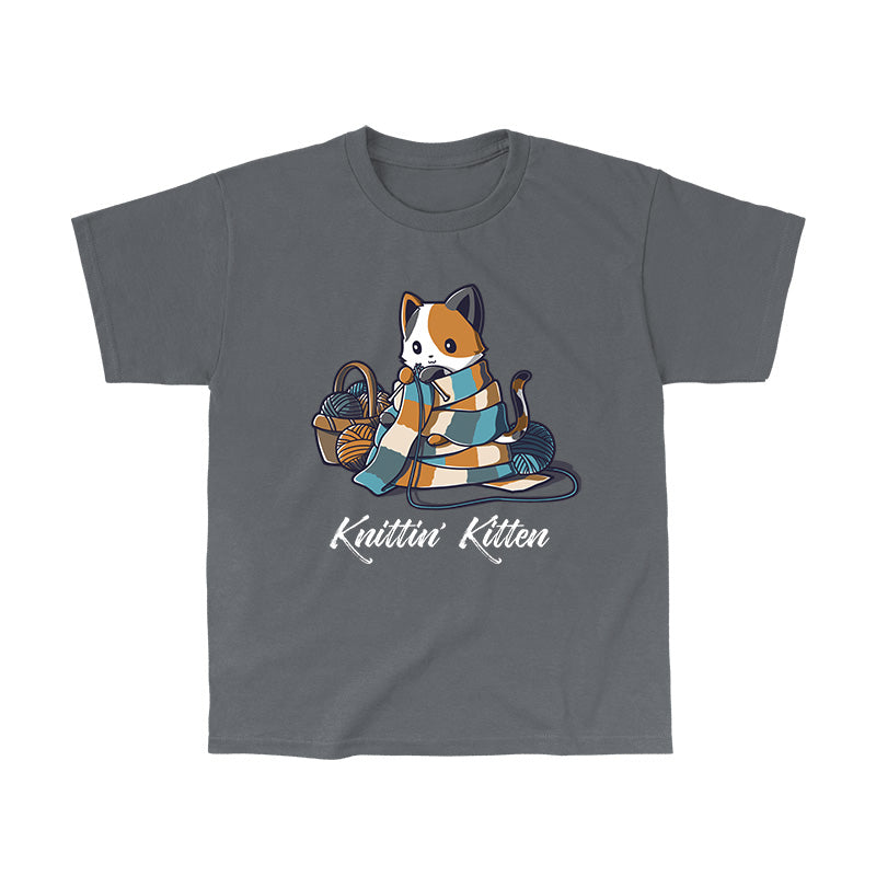 Classic Cotton T-shirt_TeeTurtle Knittin' Kitten charcoal gray t-shirt featuring a calico cat knitting a long scarf thatās wrapped around it with a basket of yarn next to it.