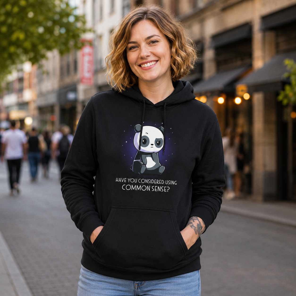 Pullover Hoodie_TeeTurtle black Have You Considered Using Common Sense? featuring a panda sitting with a skeptical expression against a starry background. The text at the bottom reads, "Have you considered using common sense?"
