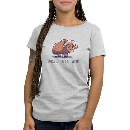 Woman wearing a "Musk Ox You a Question" unisex tee in light gray by monsterdigital featuring a pun "i must ox you a question" and a cartoon image of a musk ox.