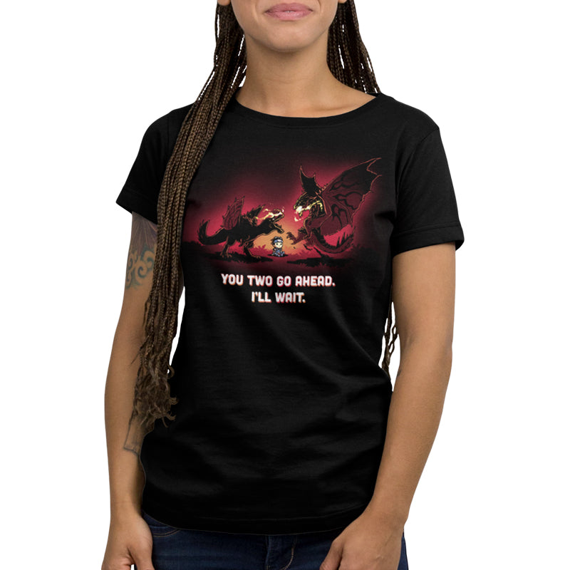 Premium Cotton T-shirt_TeeTurtle black You Two Go Ahead. I'll Wait apparel featuring two boss monsters from Monster Hunter having an intense fight, with a hunter sitting in the middle of their battlefield, and the caption, "You Two Go Ahead. I'll Wait".