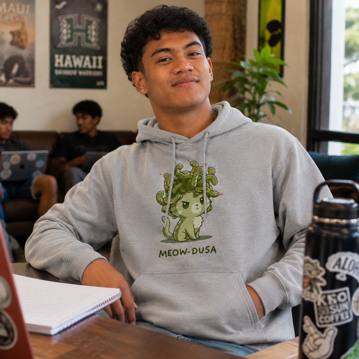 Pullover Hoodie_TeeTurtle heather gray Meow-dusa apparel featuring a grumpy green cat with a nest of snakes coiled on its head, and the caption, "Meow-dusa".