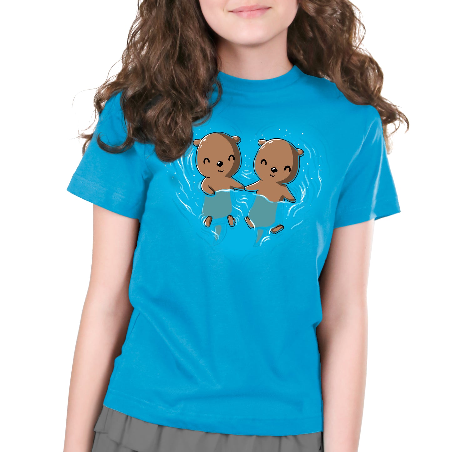 A girl wearing a cobalt blue cotton t-shirt with two My Otter Half otters on it from TeeTurtle.