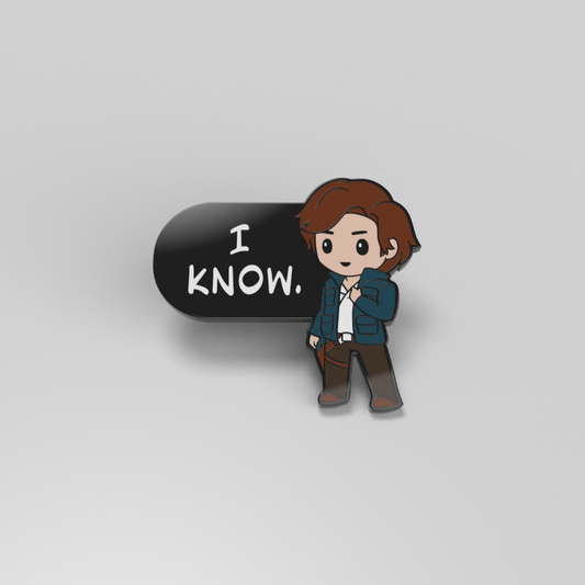 An officially licensed enamel pin featuring Han Solo with the words 