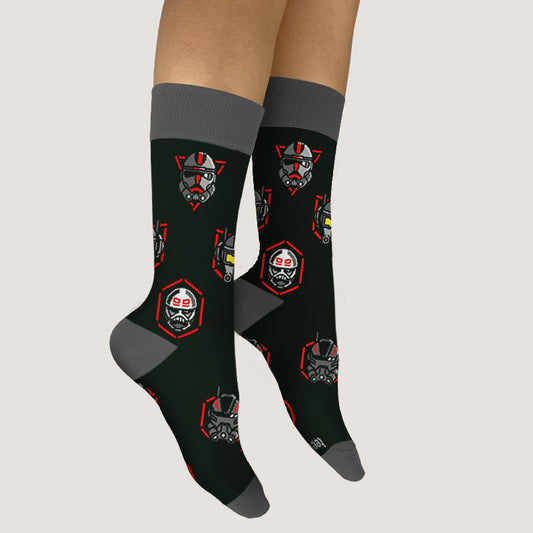 A pair of Bad Batch Socks with red and gray robot print featuring officially licensed Star Wars characters, worn on human legs.