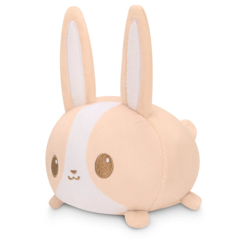 A small Plushiverse Farmer's Market Bunny Plushie Tote Bag sitting on a white surface, surrounded by TeeTurtle plushies.