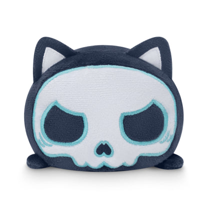 A TeeTurtle Plushiverse Skeleton Cat Plushie Tote Bag, shaped like a cat and featuring blue eyes.