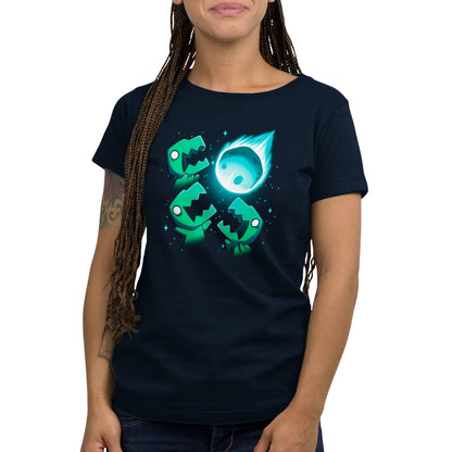 A woman wearing a TeeTurtle navy blue t-shirt with an image of the 3 T-Rex Asteroid.