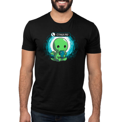 A man wearing a black t-shirt with a TeeTurtle Cthulhu Calling on it.