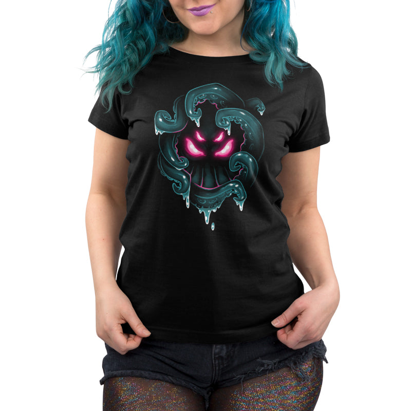 Woman wearing a black TeeTurtle Dark Cthulhu Women’s T-shirt with a neon pink and teal graphic design.