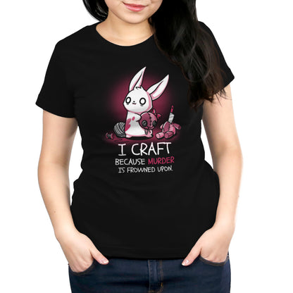 A woman wearing a Murder is Frowned Upon T-shirt from TeeTurtle is stylishly showcasing her passion for crafting.
