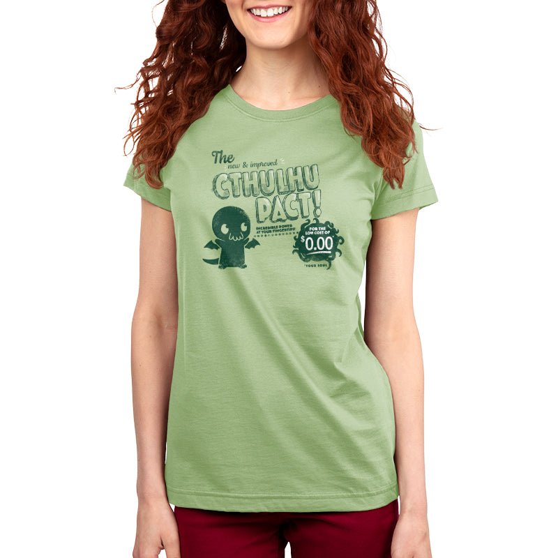 A woman smiling, wearing a green TeeTurtle cotton tee with a New & Improved Cthulhu Pact graphic design.