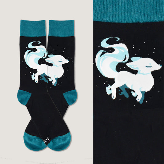 A comfortable pair of TeeTurtle Ethereal Fox Socks with a white fox on them.