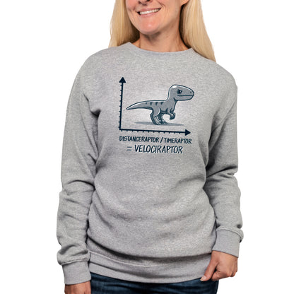 A woman wearing a gray Velociraptor T-shirt with the TeeTurtle brand on it.