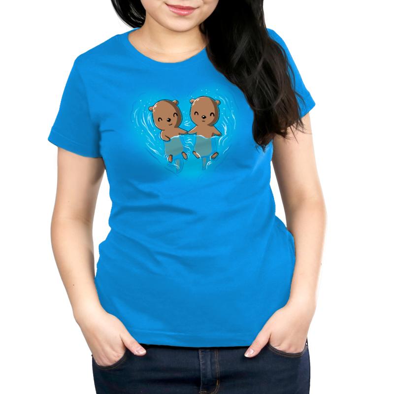 A women's blue "My Otter Half" t - shirt by TeeTurtle with two cute baby otters in the water.