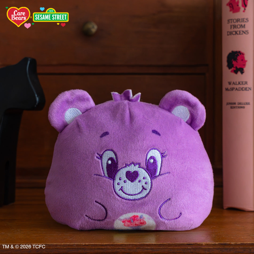 Share Bear & Cookie Monster 4" Reversible Plushie on a bookshelf