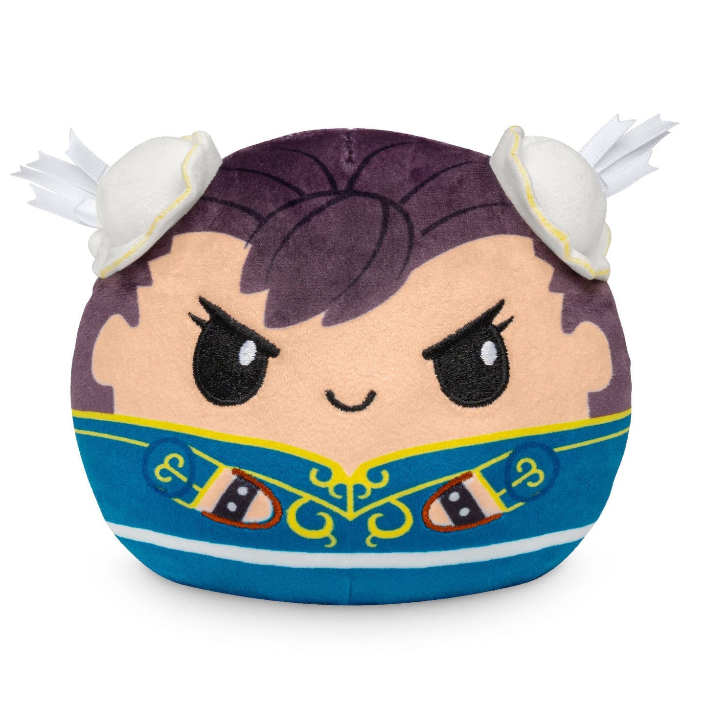 A round, plush toy with a cute, determined face, purple hair, and a blue jacket with gold accents. This **Street Fighter Plushiverse Ryu and Chun Li 4" Reversible Plushie** features white and yellow protrusions resembling small wings on its head.