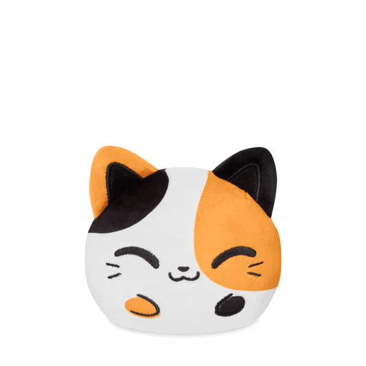 Plush toy of a cartoon-style cat with orange and black patches on a white background from TeeTurtle featuring the Plushiverse Cuddly Calico Cat 4” Reversible Plushie.
