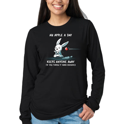 Long Sleeve T-shirt_TeeTurtle black An Apple A Day Keeps Anyone Away Long Sleeve T-shirt featuring a startled white rabbit in a teal outfit running as a red apple flies toward it, with the text "An Apple A Day Keeps Anyone Away (If You Throw It Hard Enough)."