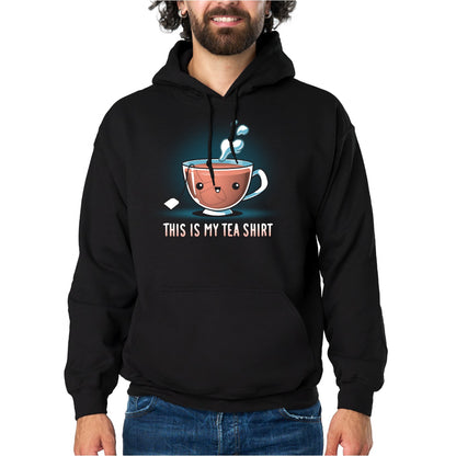 Pullover Hoodie_TeeTurtle black My Tea Shirt featuring a smiling teacup with a tea bag inside. Text below reads, "This is My Tea Shirt."
