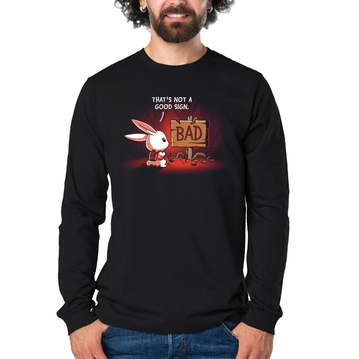 Long Sleeve T-shirt_TeeTurtle black That's Not a Good Sign Long Sleeve T-shirt featuring a white rabbit with a red backpack staring at a broken wooden sign labeled "BAD," with the text "That's Not a Good Sign."