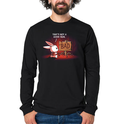 Long Sleeve T-shirt_TeeTurtle black That's Not a Good Sign Long Sleeve T-shirt featuring a white rabbit with a red backpack staring at a broken wooden sign labeled "BAD," with the text "That's Not a Good Sign."