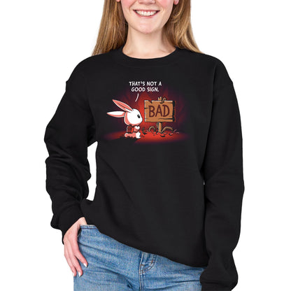 Crew Neck Sweatshirt_TeeTurtle black That's Not a Good Sign Crew Neck Sweatshirt featuring a white rabbit with a red backpack staring at a broken wooden sign labeled "BAD," with the text "That's Not a Good Sign."