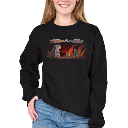 Crew Neck Sweatshirt_TeeTurtle black Godzilla Fight Screen Crew Neck Sweatshirt featuring Godzilla facing a burning Tokyo skyline in a retro fighting game scene with health bars labeled "Godzilla" and "Tokyo."