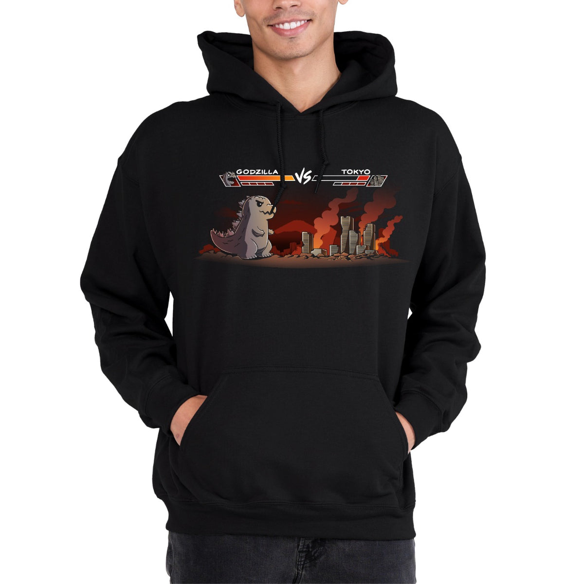 Pullover Hoodie_TeeTurtle black Godzilla Fight Screen Pullover Hoodie featuring Godzilla facing a burning Tokyo skyline in a retro fighting game scene with health bars labeled "Godzilla" and "Tokyo."