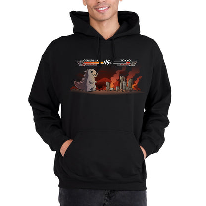 Pullover Hoodie_TeeTurtle black Godzilla Fight Screen Pullover Hoodie featuring Godzilla facing a burning Tokyo skyline in a retro fighting game scene with health bars labeled "Godzilla" and "Tokyo."