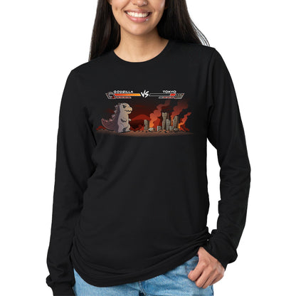Long Sleeve T-shirt_TeeTurtle black Godzilla Fight Screen Long Sleeve T-shirt featuring Godzilla facing a burning Tokyo skyline in a retro fighting game scene with health bars labeled "Godzilla" and "Tokyo."