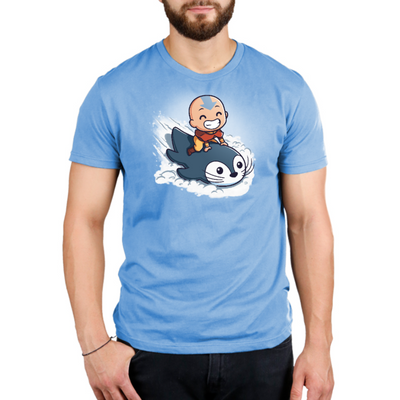 Premium Cotton T-shirt_TeeTurtle light blue Penguin Sledding Premium Cotton T-shirt featuring Aang from Avatar: The Last Airbender joyfully riding an otter penguin through the snow as if it were a sled.