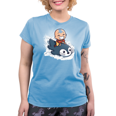 Premium Cotton T-shirt_TeeTurtle light blue Penguin Sledding Premium Cotton T-shirt featuring Aang from Avatar: The Last Airbender joyfully riding an otter penguin through the snow as if it were a sled.