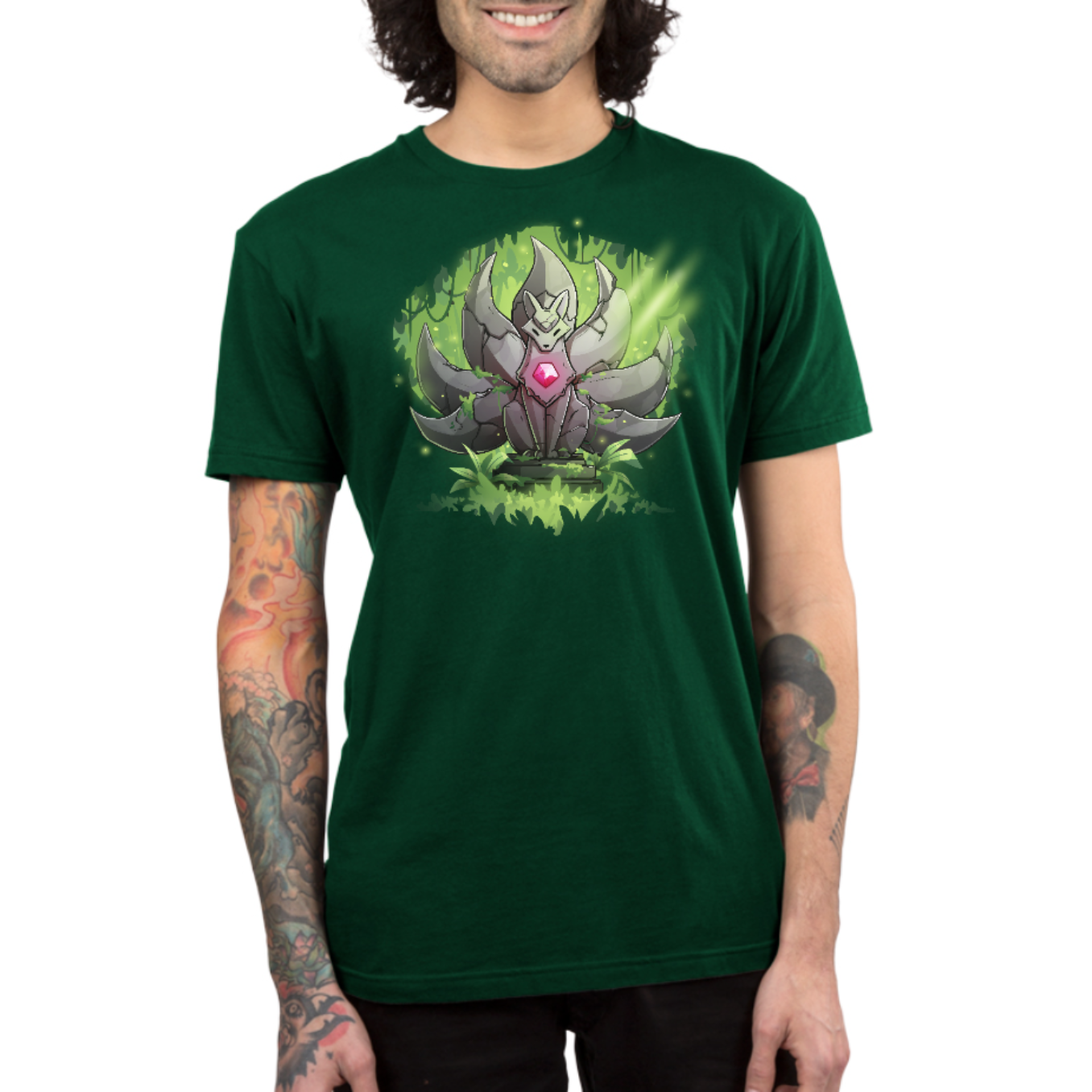 Premium Cotton T-shirt_TeeTurtle forest green Kitsune Statue Premium Cotton T-shirt featuring a stone statue of a kitsune with seven tails and a glowing pink gem in its chest, covered with moss and surrounded by forest, with a beam of light hitting it from above