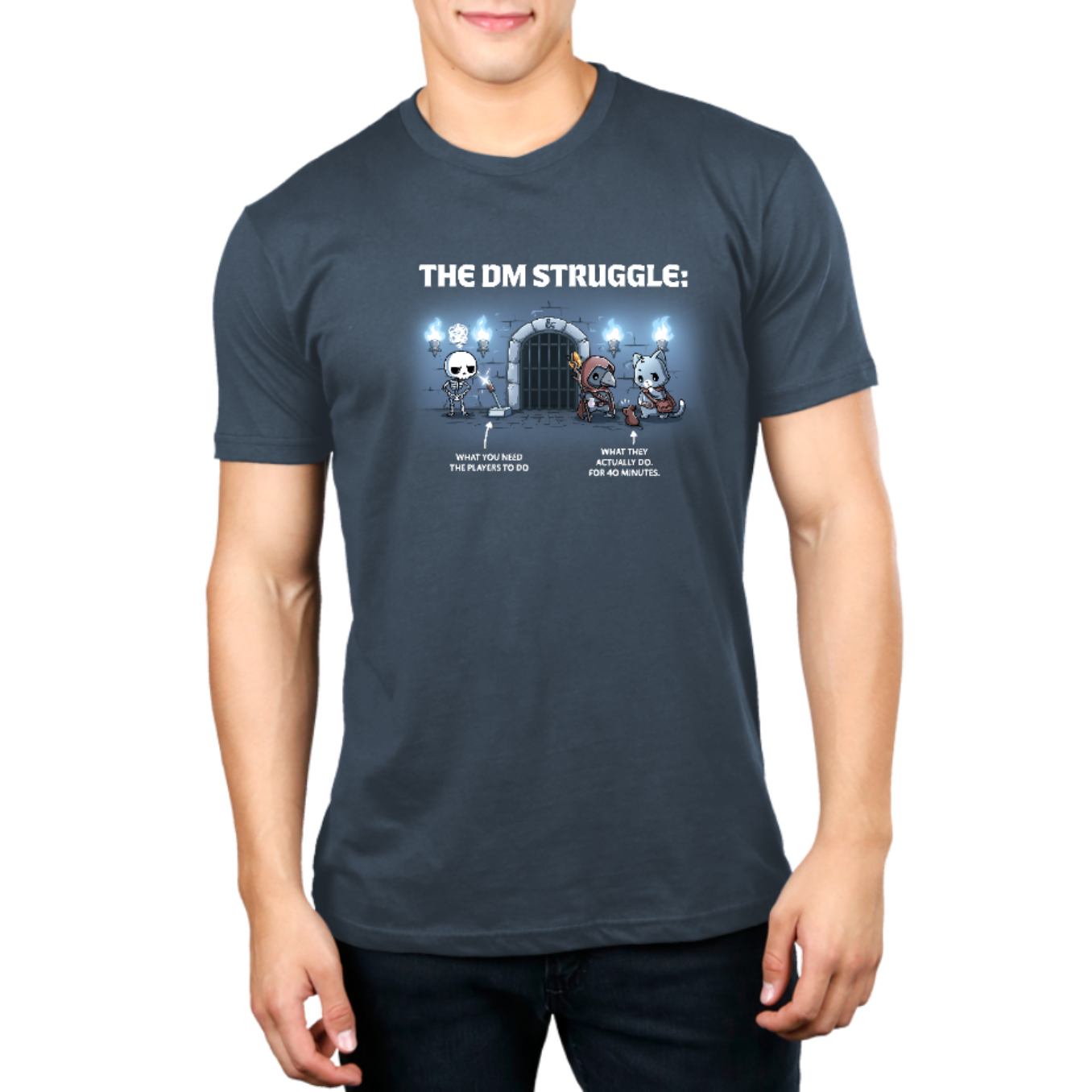 Premium Cotton T-shirt_TeeTurtle denim blue The DM Struggle Premium Cotton T-shirt featuring a grumpy skeleton standing next to a glowing lever and two player characters nearby talking to a rat. Under the skeleton is the text "what you need the players to do" and under the players is the text "what they actually do. for 40 minutes." 