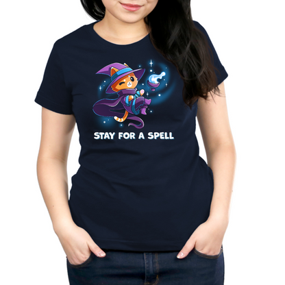 Premium Cotton T-shirt_TeeTurtle navy Stay For A Spell Premium Cotton T-shirt featuring an orange cat dressed as a witch, floating in space with a cauldron floating nearby. The cat is winking and the text at the bottom reads "Stay For A Spell" 