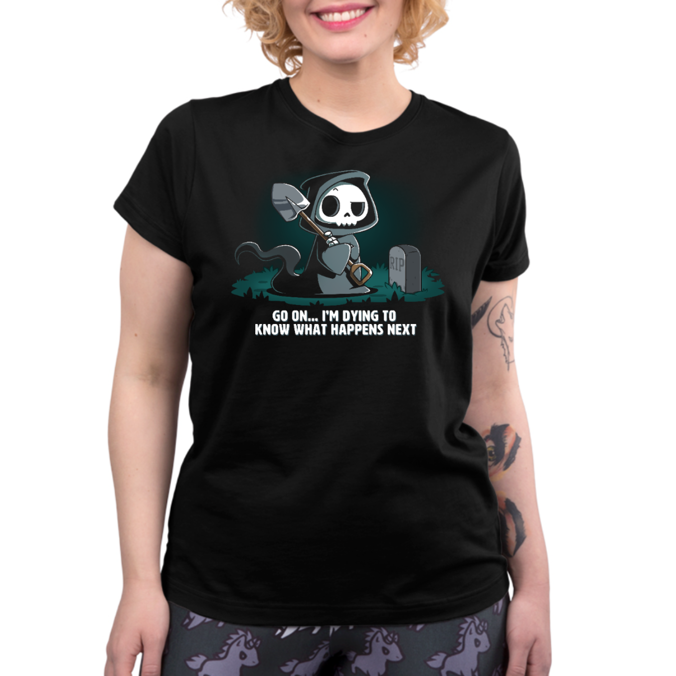 Premium Cotton T-shirt_TeeTurtle black Dying to Know What Happens Next Premium Cotton T-shirt featuring a grim reaper with crossed arms, a raised eyebrow and a shovel near a gravestone and the text "Go On... I'm Dying to Know What Happens Next" below it. 