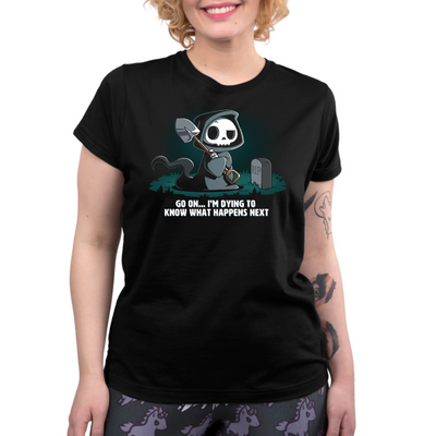 Premium Cotton T-shirt_TeeTurtle black Dying to Know What Happens Next Premium Cotton T-shirt featuring a grim reaper with crossed arms, a raised eyebrow and a shovel near a gravestone and the text "Go On... I'm Dying to Know What Happens Next" below it. 