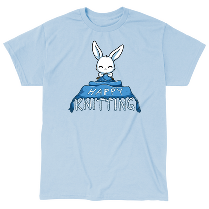Classic Cotton T-shirt_TeeTurtle light blue Happy Knitting apparel featuring a bunny knitting a large blue blanket whose tassels end in the knitted words, “Happy Knitting“.