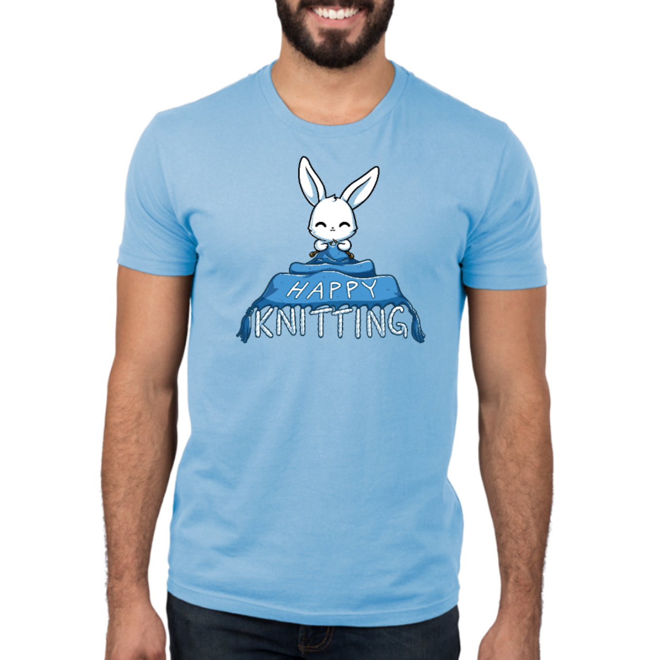 Premium Cotton T-shirt_TeeTurtle light blue Happy Knitting apparel featuring a bunny knitting a large blue blanket whose tassels end in the knitted words, “Happy Knitting“.