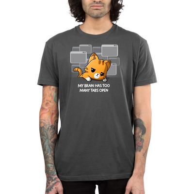 Premium Cotton T-shirt_TeeTurtle charcoal My Brain Has Too Many Tabs Open Premium Cotton T-shirt featuring an overwhelmed orange cat with a serious expression leaning on a table with a bunch of browser tabs open behind them. Text at the bottom reads "My Brain Has Too Many Tabs Open." 