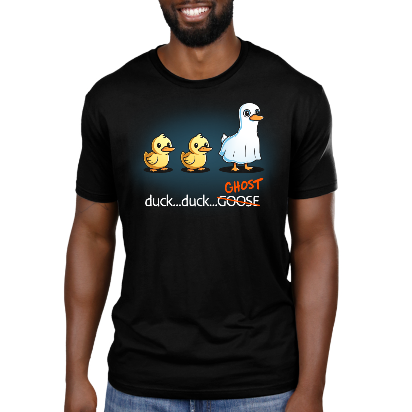 Premium Cotton T-shirt_TeeTurtle black Duck...Duck...Ghost Premium Cotton T-shirt featuring two normal ducks followed by a third duck dressed as a ghost in a white sheet, creating a playful twist on the classic "Duck, Duck, Goose" game.
